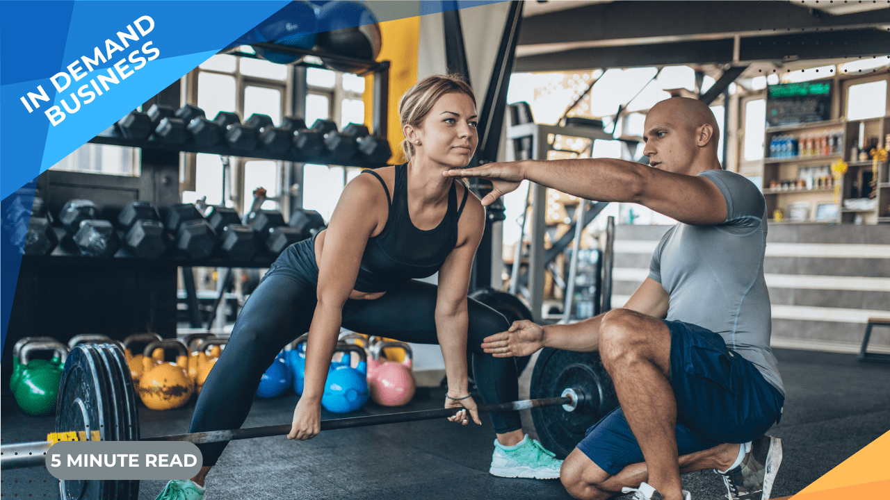 Male person trainer showing female client a fitness move