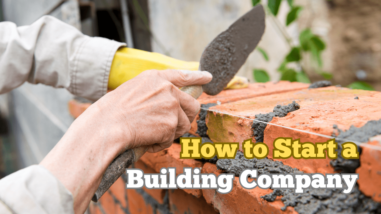 A close up of a builders hand as he is laying house bricks.